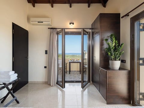 Lovely petite balcony with a view of the Cretan plains and the sea.