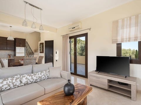 Living room equipped with a smart TV for momrnts of relaxation and entertainment