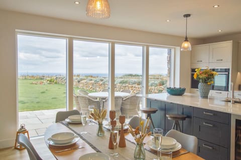 Polberro Cottage, Ground Floor: Large sliding doors connect the open-plan area to the beautiful garden