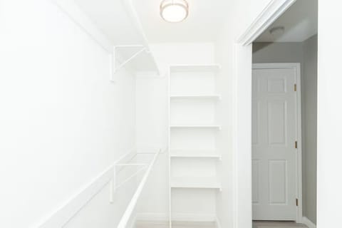 Primary bedroom walk-in closet.
