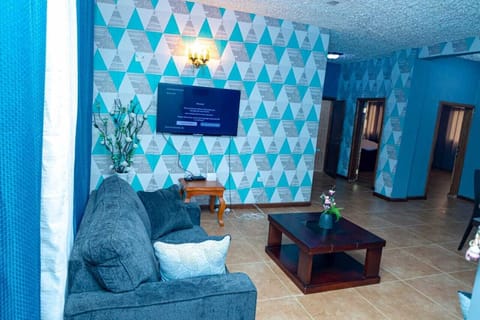 Comfort Apartment | Living area | 32-inch flat-screen TV with satellite channels