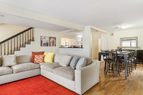 The dining area seats eight, and is conveniently located between the kitchen and living area.