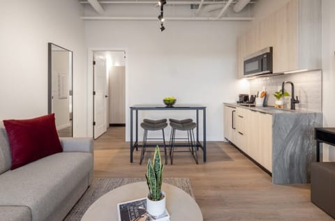 Waterfront Junior One Bedroom Suite | Living area | 55-inch Smart TV with cable channels