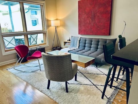 The living/dining area. The original art throughout my condo changes regularly. 