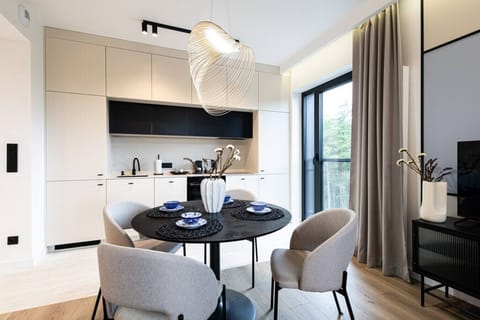 atmospheric and family dining table behind which you can see the kitchenette