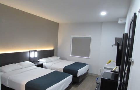 Deluxe Room, 2 Double Beds, Non Smoking, Refrigerator & Microwave | Free WiFi, bed sheets