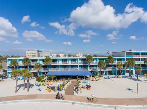 On the beach, white sand, beach towels, beach volleyball