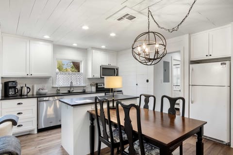 Your country kitchen here is decked out with plenty of appliances, including a dishwasher and coffee maker.