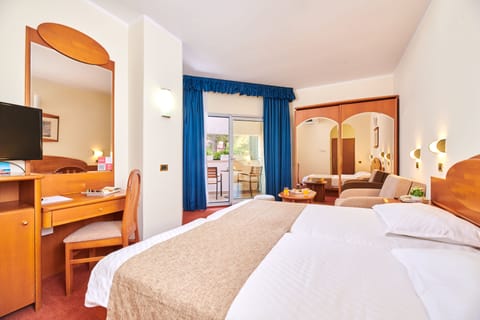 Family Room with Balcony - Sea Side | Minibar, in-room safe, travel crib, free WiFi