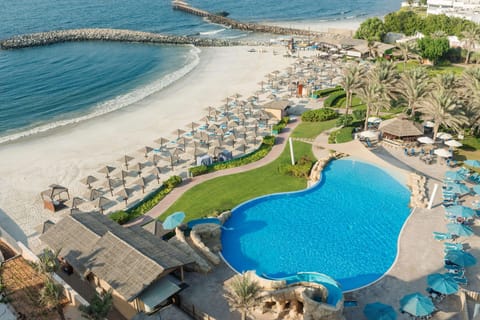 Private beach, white sand, sun loungers, beach umbrellas