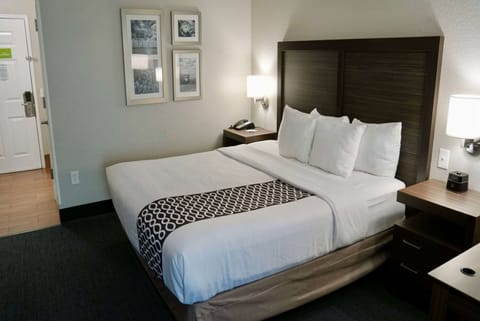 Premium bedding, desk, laptop workspace, iron/ironing board