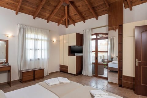 Luxurious bedroom with a balcony and a wardrobe.