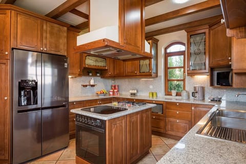 Style meets function in our chic kitchen—fully equipped for your cooking adventures, with an added touch of warmth!