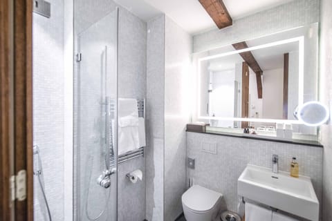 Shower, eco-friendly toiletries, hair dryer, towels