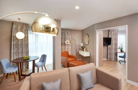 Deluxe Suite, 1 King Bed (Water View) | In-room safe, desk, laptop workspace, blackout drapes