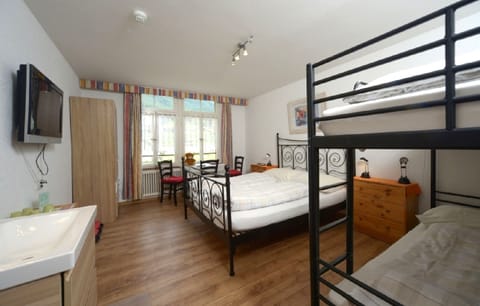 Standard Quadruple Room, Private Bathroom | In-room safe, desk, cribs/infant beds, free WiFi