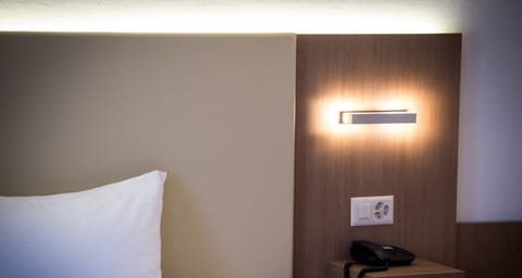 Standard Double Room | Minibar, in-room safe, desk, blackout drapes