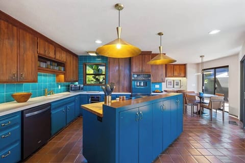 Fully stocked kitchen with table that seats up to 6.