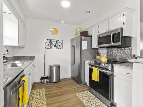 Bright and shiny kitchen with natural stone quartzite countertops.