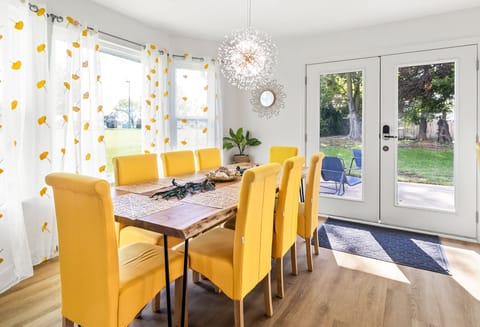 Gather and celebrate in this light-filled dining room surrounded by big windows.