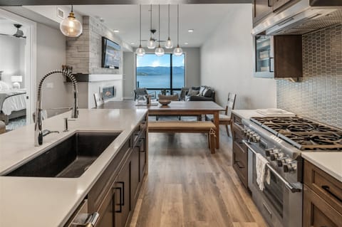 Thermador appliances, gas cooktop and Quartz countertops.