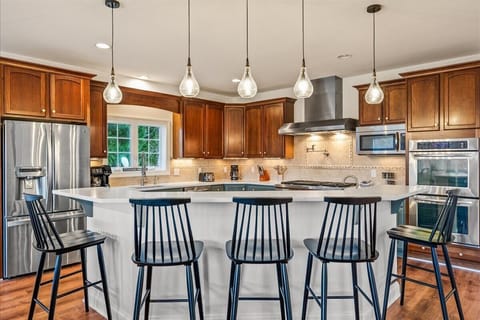 Seating at the island and an open layout are perfect for entertaining and enjoying quality time together during your vacation