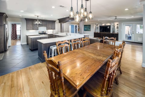 open dining, kitchen, living, doors to pool