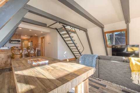 Open concept living / dining / kitchen with views of Lake Tahoe