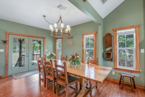 Grand dining table with plenty of room for guests to enjoy a meal together