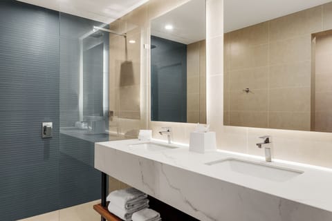 Suite, 1 Bedroom | Bathroom | Shower, rainfall showerhead, designer toiletries, hair dryer