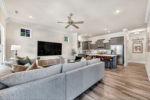 Enjoy Open-Concept Living boasting an 86" 4K TV & comfortable seating for all.