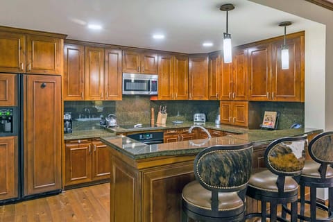 Full kitchen with upgraded stainless steel appliances.
