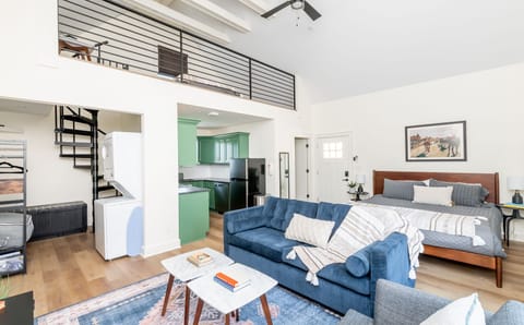 The Rickhouse loft features soaring ceiling bright modern design