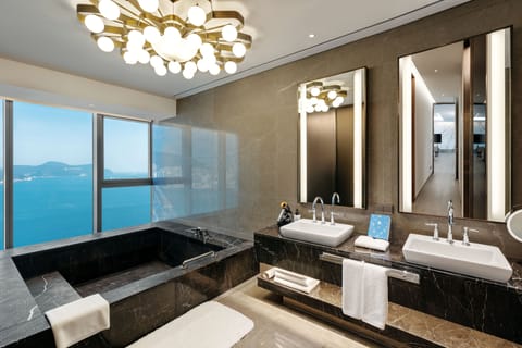 Suite, 1 King Bed, Non Smoking (Wyndham) | Bathroom | Designer toiletries, hair dryer, bathrobes, slippers