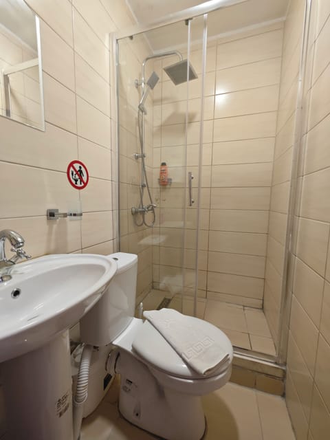 Family Studio, City View | Bathroom | Shower, hair dryer, towels