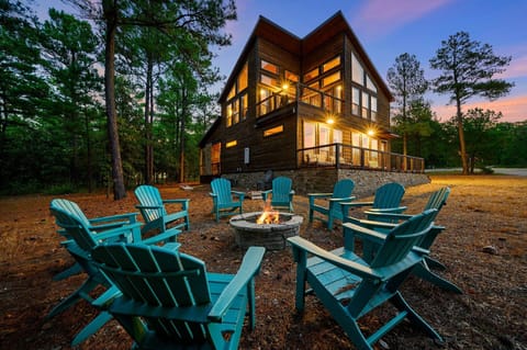 Enjoy the pine trees and bright stars on spacious acreage around the firepit.