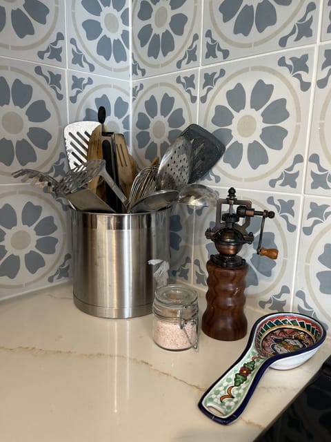 Fully stocked with cooking utensils.