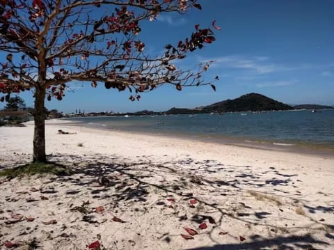 On the beach, white sand, beach umbrellas, beach yoga