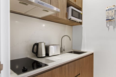 Studio Suite | Private kitchen | Microwave, stovetop, electric kettle, toaster