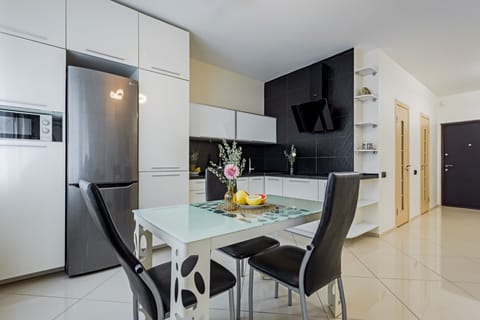 Apartment | Private kitchen | Fridge, electric kettle, cookware/dishes/utensils, cleaning supplies