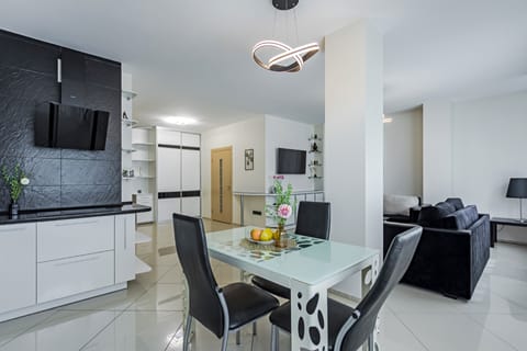 Apartment | Private kitchen | Fridge, electric kettle, cookware/dishes/utensils, cleaning supplies