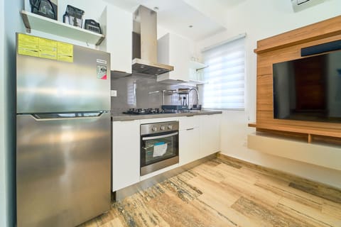 Panoramic Condo | Private kitchen | Full-size fridge, stovetop, coffee/tea maker, highchair