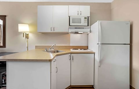 Studio, 1 Queen Bed, Non Smoking | Private kitchen | Full-size fridge, microwave, cookware/dishes/utensils