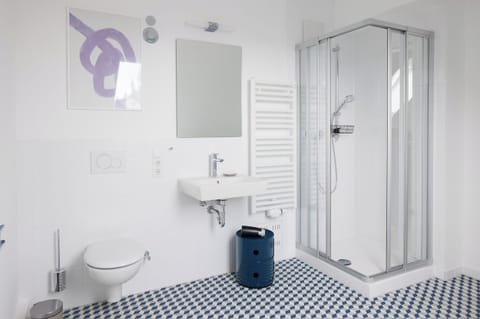 Shower, eco-friendly toiletries, hair dryer, towels