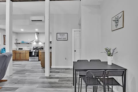 The dining is behind the living area, and the bathroom is through the door straight ahead