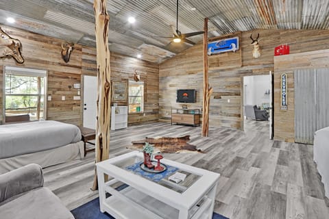 There is a TV across from the queen bed