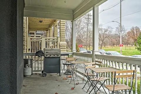 Our patio features two charming wooden table sets with chairs, perfect for al fresco dining, and a griller for your cookout delights—all with a beautiful view of nature.