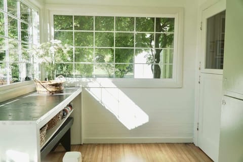 Step through the mudroom door into the kitchen.
