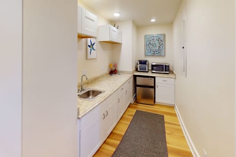 Kitchenette is equipped with enough for a tasty meal.