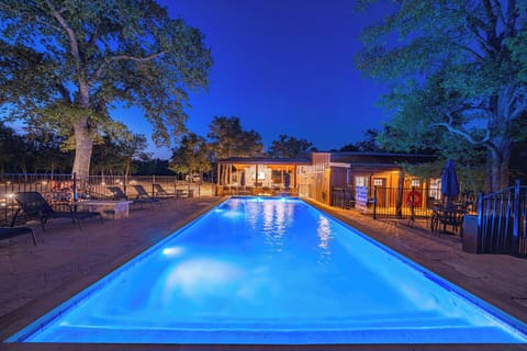Stunning pool retreat in Wimberley, Texas! Enjoy a late-night swim under the stars in our illuminated community pool. Perfect for cooling off after a day exploring the beautiful Texas Hill Country!